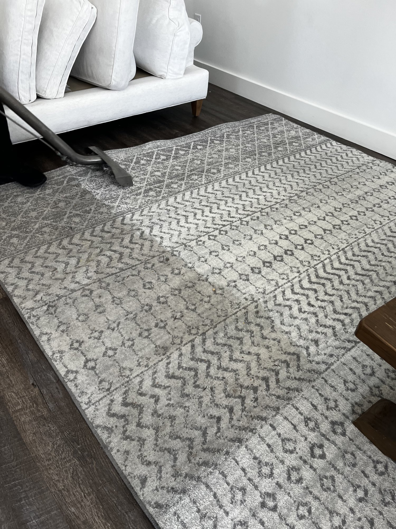 Detailed area rug cleaning in a well-appointed Emerald Coast home