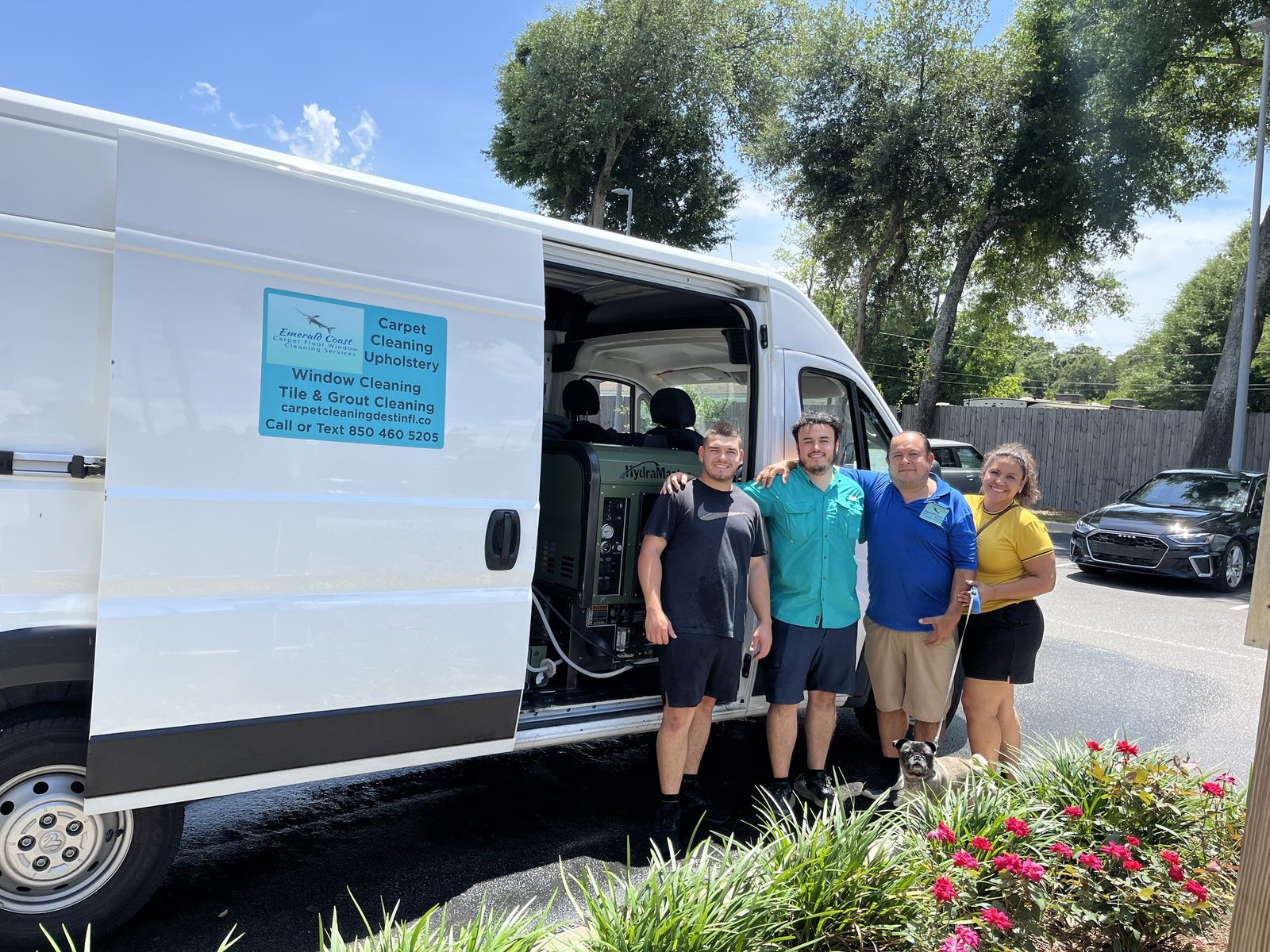 Emerald Coast Carpet Cleaning crew beside the full professional service van