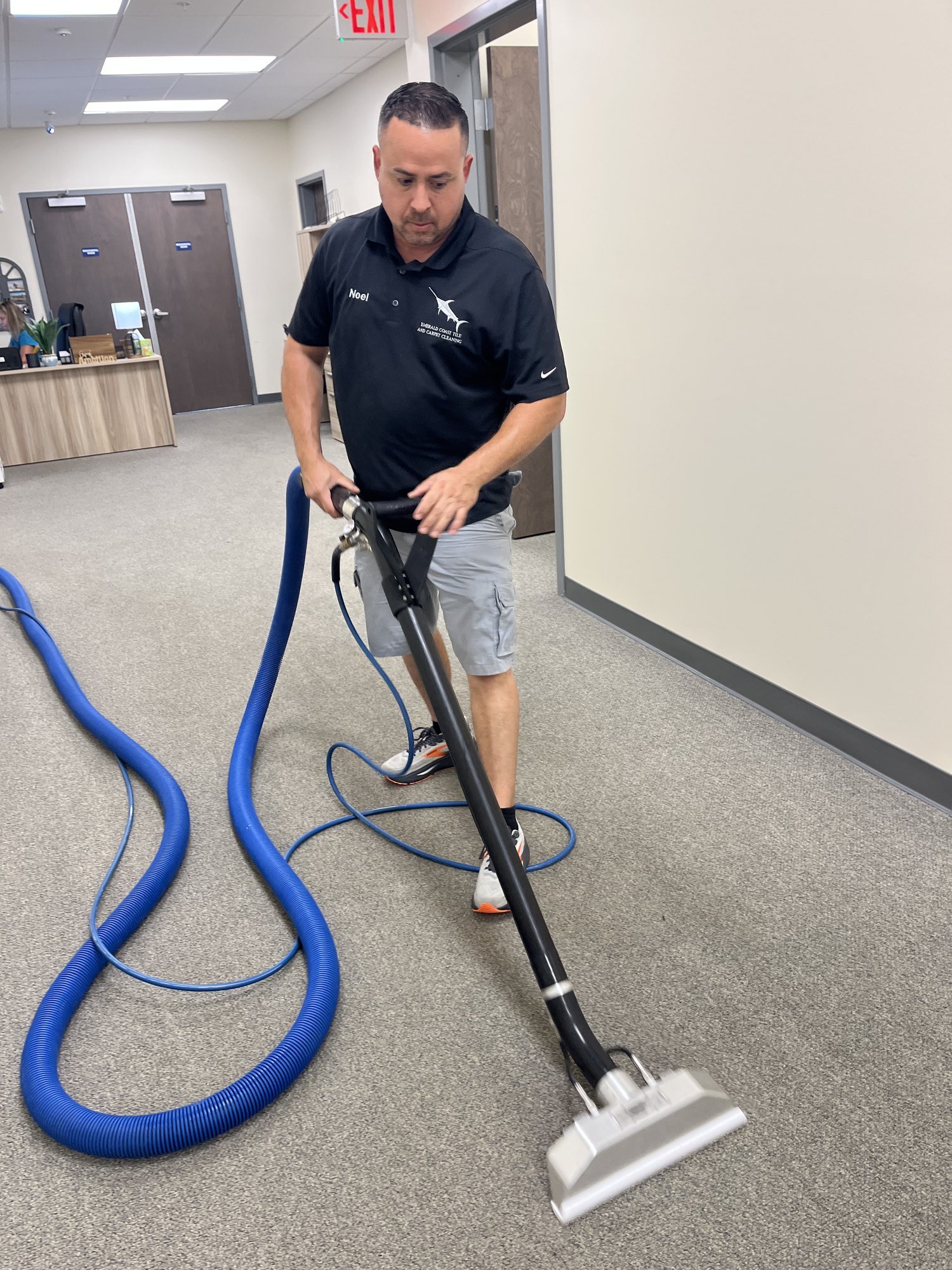 Emerald Coast technician extracting carpet during pet stain and odor treatment